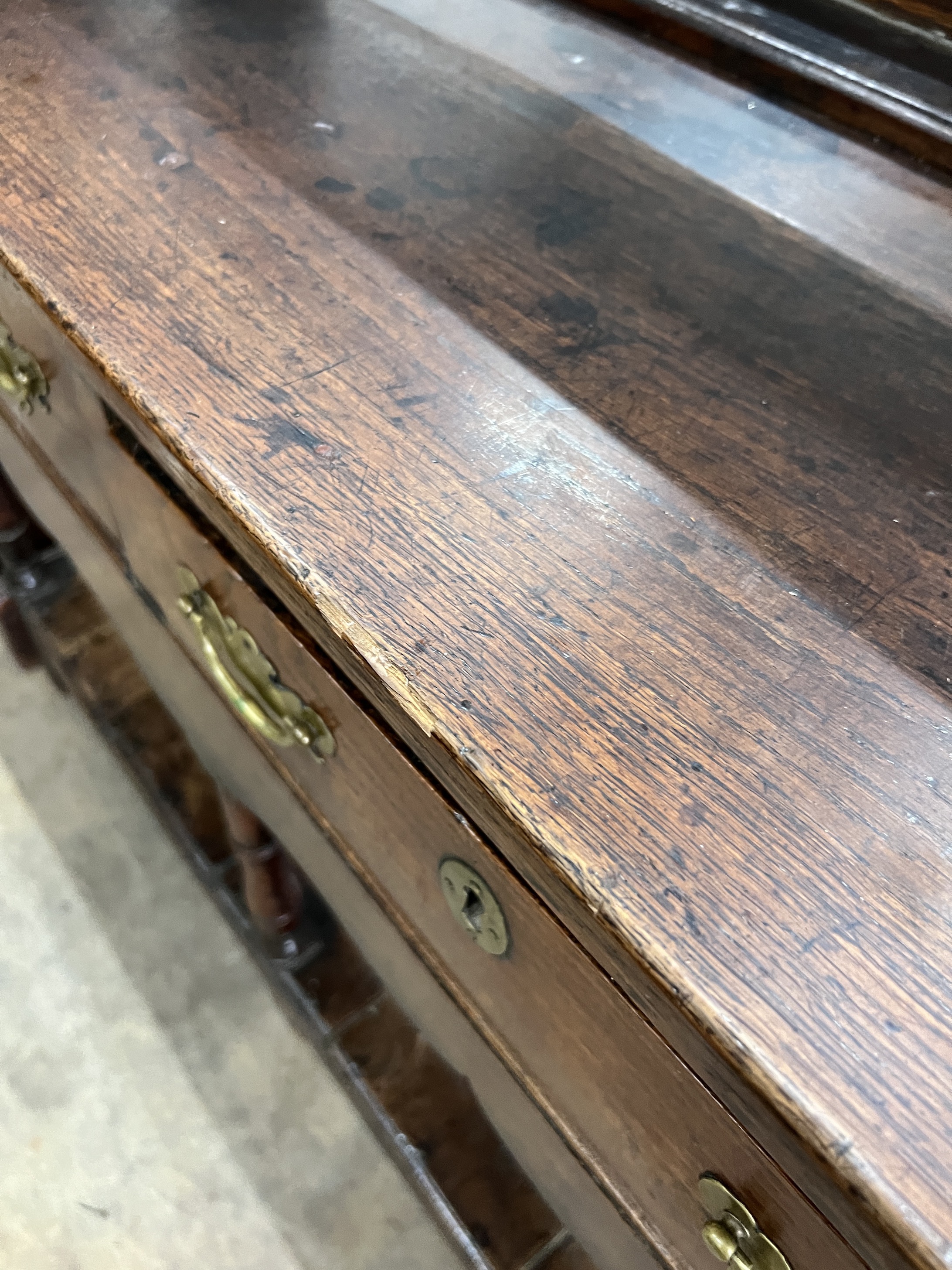 An 18th century oak potboard dresser with open rack, width 159cm, depth 45cm, height 206cm